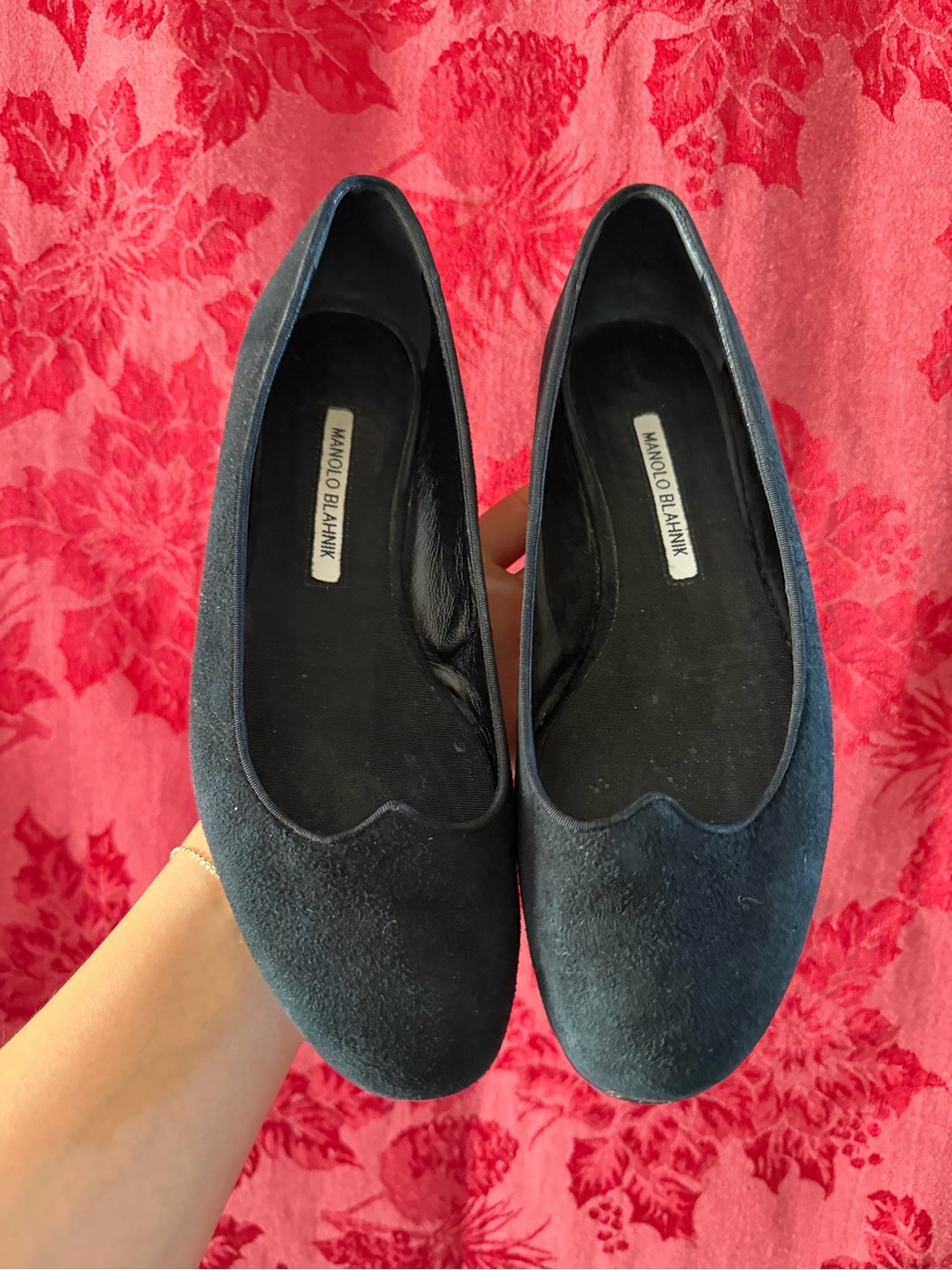 Manolo Blahnik black suede ballet flats, featuring a subtle scalloped cut